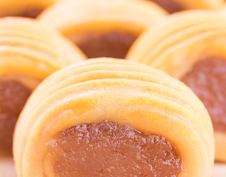 Close up Pineapple pie sweet and delicious on a wooden boardの写真素材