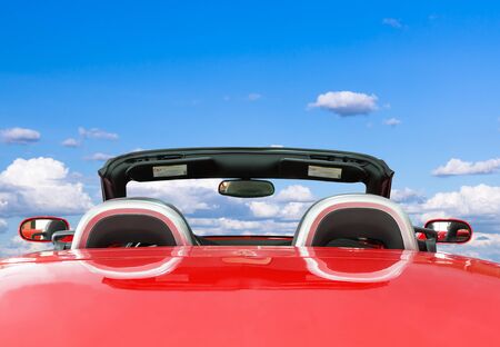 Car rear view the red car with blue sky backgroundの写真素材