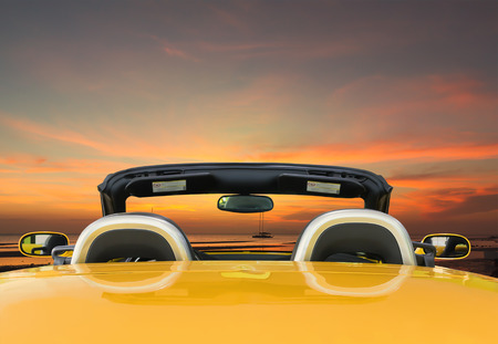 Car rear view the yellow car with twilight backgroundの写真素材