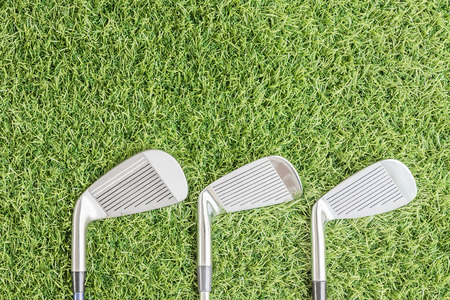 Top view row of golf club on green grassの写真素材