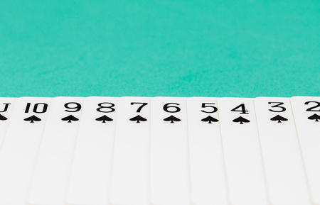 Cards on green casino table, Gambling is illegal.