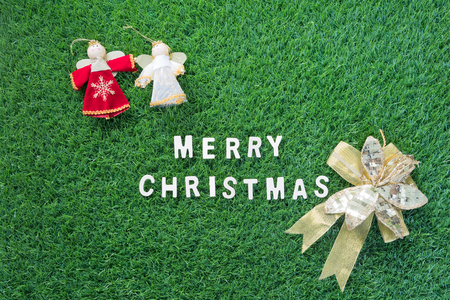 Celebration of New year and Christmas, Top view Christmas alphabet and decoration on green grass backgroundの写真素材