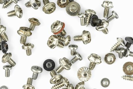Set of old screws on the white backgroundの写真素材