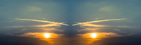 Abstract Panoramic sunset with fluffy clouds in the twighligth skyの写真素材