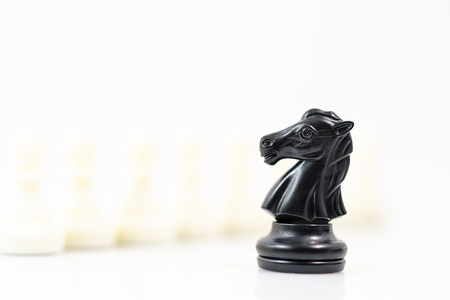 Close up Set of black and white chess pieces on chessboard, Set of chess figures on white backgroundの写真素材