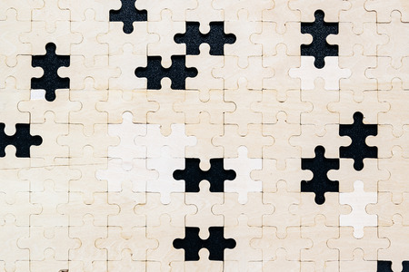 Top view of Jigsaw puzzle pieces on black backgroundの写真素材