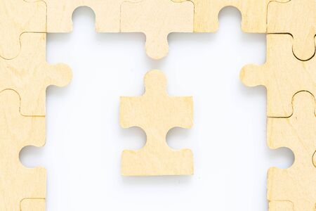Shot of wooden jigsaw puzzle pieces on white background,Business conceptの写真素材