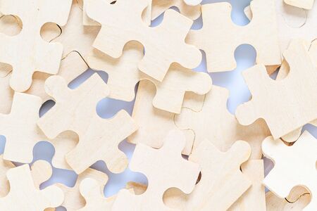 Shot of wooden jigsaw puzzle pieces on white background,Business conceptの写真素材