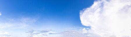 Fantastic soft clouds against blue sky, Panoramic white fluffy clouds in the blue skyの写真素材