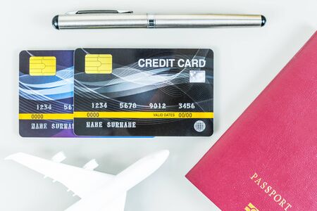 Passport and credit card,airplan on white background, Traveling conceptの写真素材