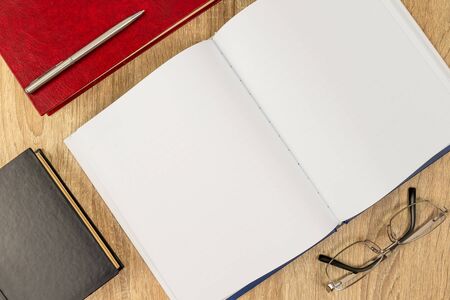 Top view empty blank notebook diary and eye glassesの写真素材