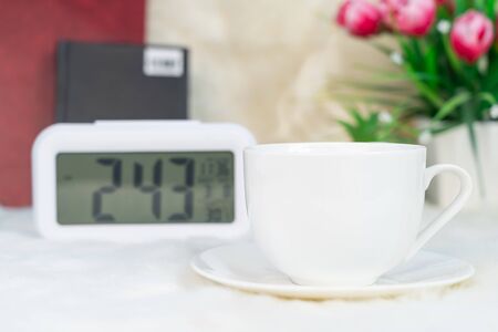 Digital clock and cup of coffee ,Coffee timeの写真素材