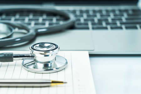 Medical stethoscope for doctor checkup on notepad as medical conceptの写真素材