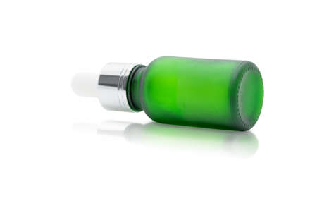 Green glass dropper serum bottle on white background, Mockup for cosmetic product designの写真素材