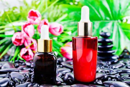 Green glass dropper serum bottle on white background, Mockup for cosmetic product designの写真素材