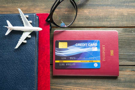 Credit card put on passport on wooden deskの写真素材