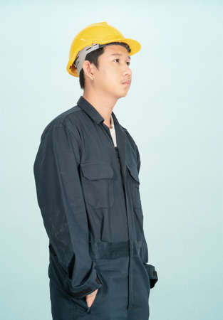 Young man wearing helmet isolated on blue