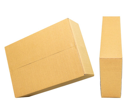 Mockup for design. Closed Brown cardboard box isolated on white backgroundの写真素材