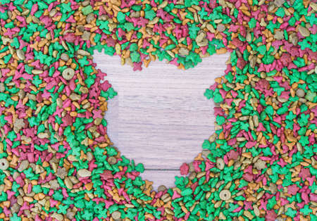 Top view dry cat food on wooden background with copy spaceの写真素材
