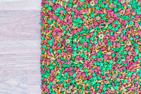 Top view dry cat food on wooden background with copy spaceの写真素材