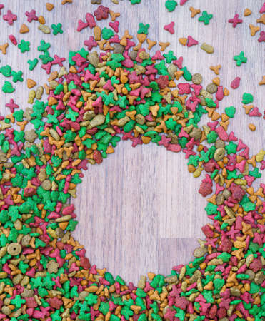 Top view dry cat food on wooden background with copy spaceの写真素材