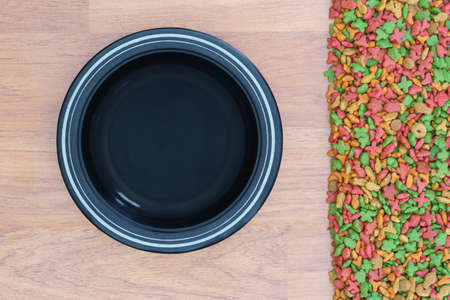 Top view dry food for cat and dog with empty bowlの写真素材