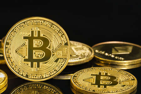 Bitcoin cryptocurrency digital bit coin BTC currency concept ,Golden coins with bitcoin symbol on a...
