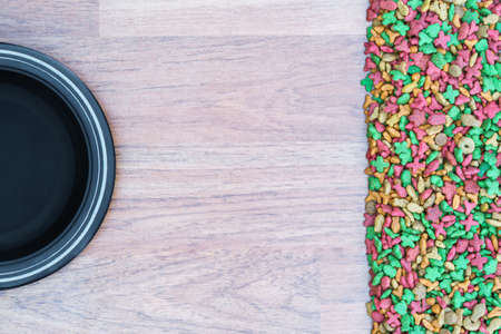 Top view dry food for cat and dog with empty bowlの写真素材