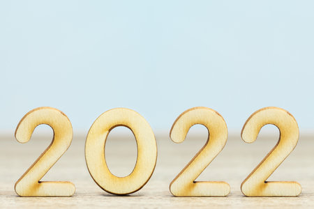 Close up wooden numeric new year 2022 on table with copy spaceの写真素材
