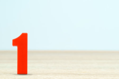 Shot of a number one made of red plastic on table with copy spaceの写真素材