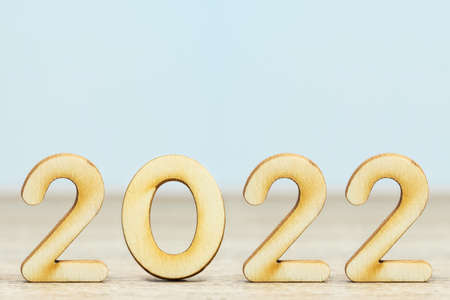 Close up wooden numeric new year 2022 on table with copy spaceの写真素材