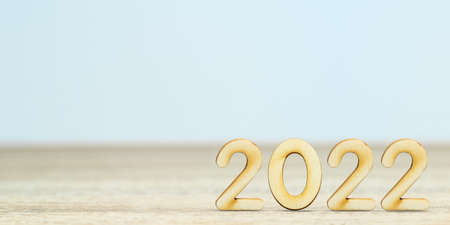 Wooden numeric new year 2022 on table with copy spaceの写真素材
