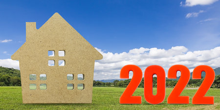 House model and number 2022 with landscape back background for finance and banking conceptの写真素材