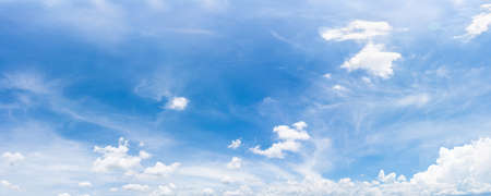 Panorama fluffy clouds in the blue sky, Panoramic fluffy clouds against blue skyの写真素材