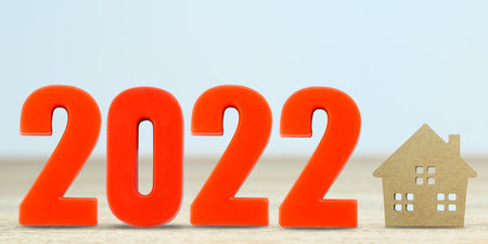 House model and number 2022 on table for finance and banking concept with copy spaceの写真素材