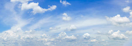Panorama fluffy clouds in the blue sky, Panoramic fluffy clouds against blue skyの写真素材