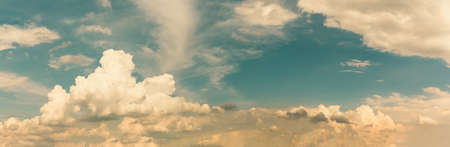 Summer cloud sky panorama with fleece clouds, Vibrant color panoramic sky with cloud on a sunny dayの写真素材