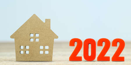 House model and number 2022 on table for finance and banking concept with copy spaceの写真素材