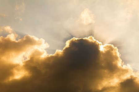Sunset with fluffy clouds in the twilight sky,Sunlight with dramatic cloudの写真素材