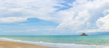 Panoramic nature landscape view of beautiful tropical beach and sea in sunny day with small islandの写真素材