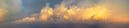 Panorama of Dramatic vibrant color with beautiful cloud of sunrise. Panoramic imageの写真素材