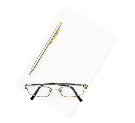 Eyeglasses and notepad on white backgroundの写真素材