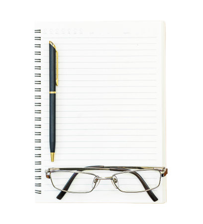 Eyeglasses and notepad on white backgroundの写真素材