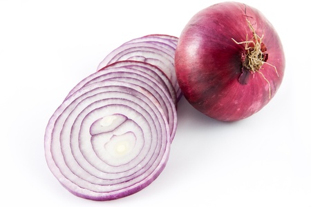 Picture of a red onion sliced up and a whole oneの写真素材