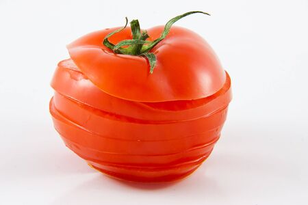 Picture of a single sliced tomatoeの写真素材