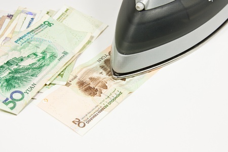 Picture of a iron and some moneyの写真素材