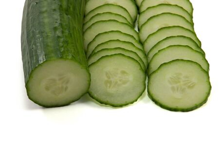 Picture of a half cucumber and some slicesの写真素材