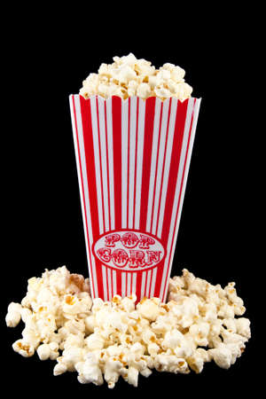 Picture of some popcorn in a holder with popcorn on the bottomの写真素材