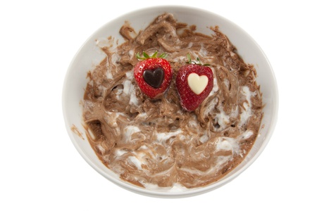 Chocolate mouse with some strawberries with hearts in themの写真素材