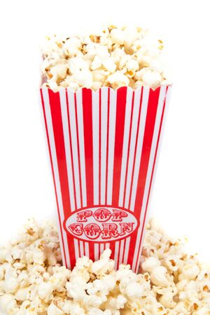 Popcorn in a basket and in front of the holderの写真素材